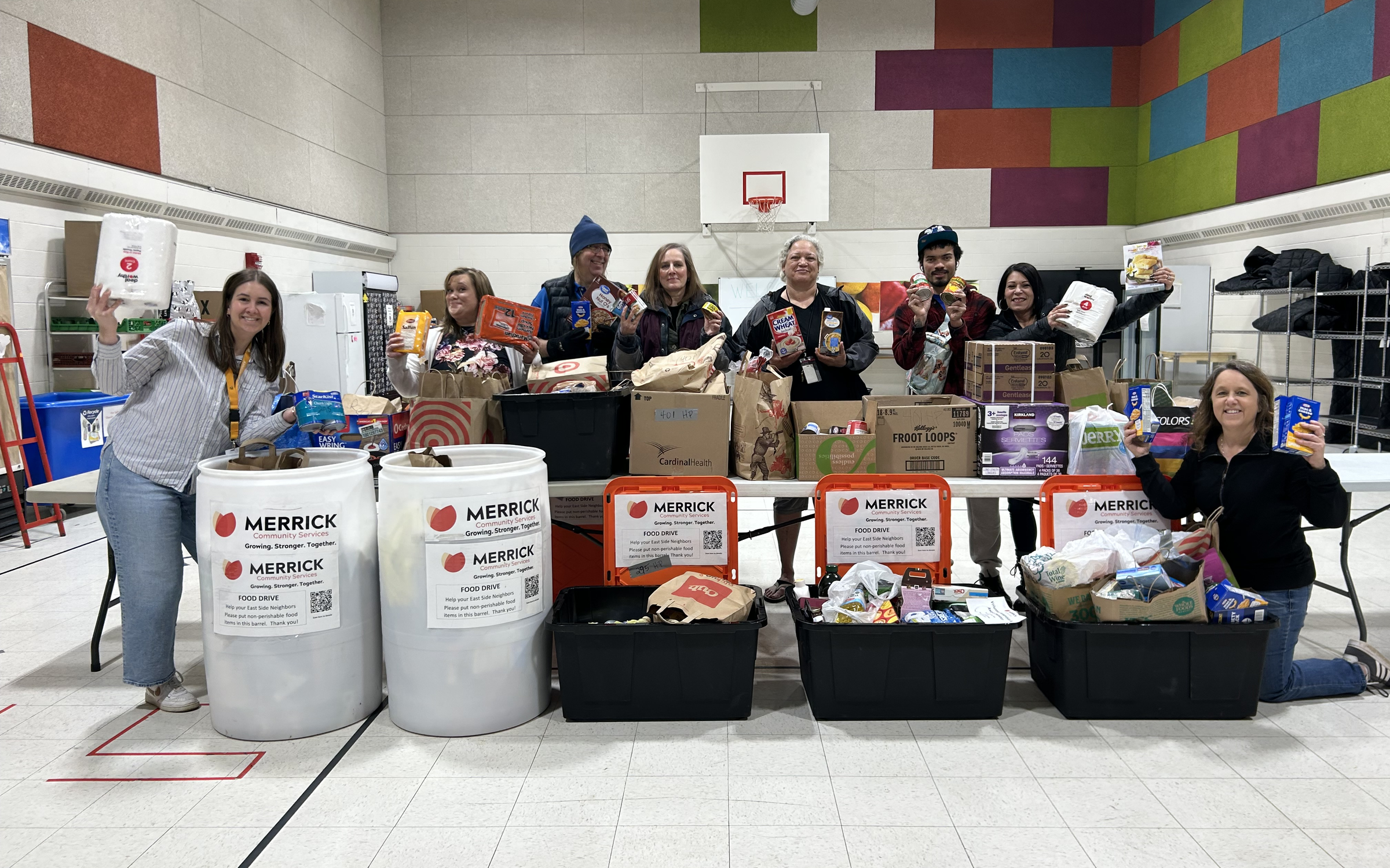 Community members with collected food donations for Merrick Community Services