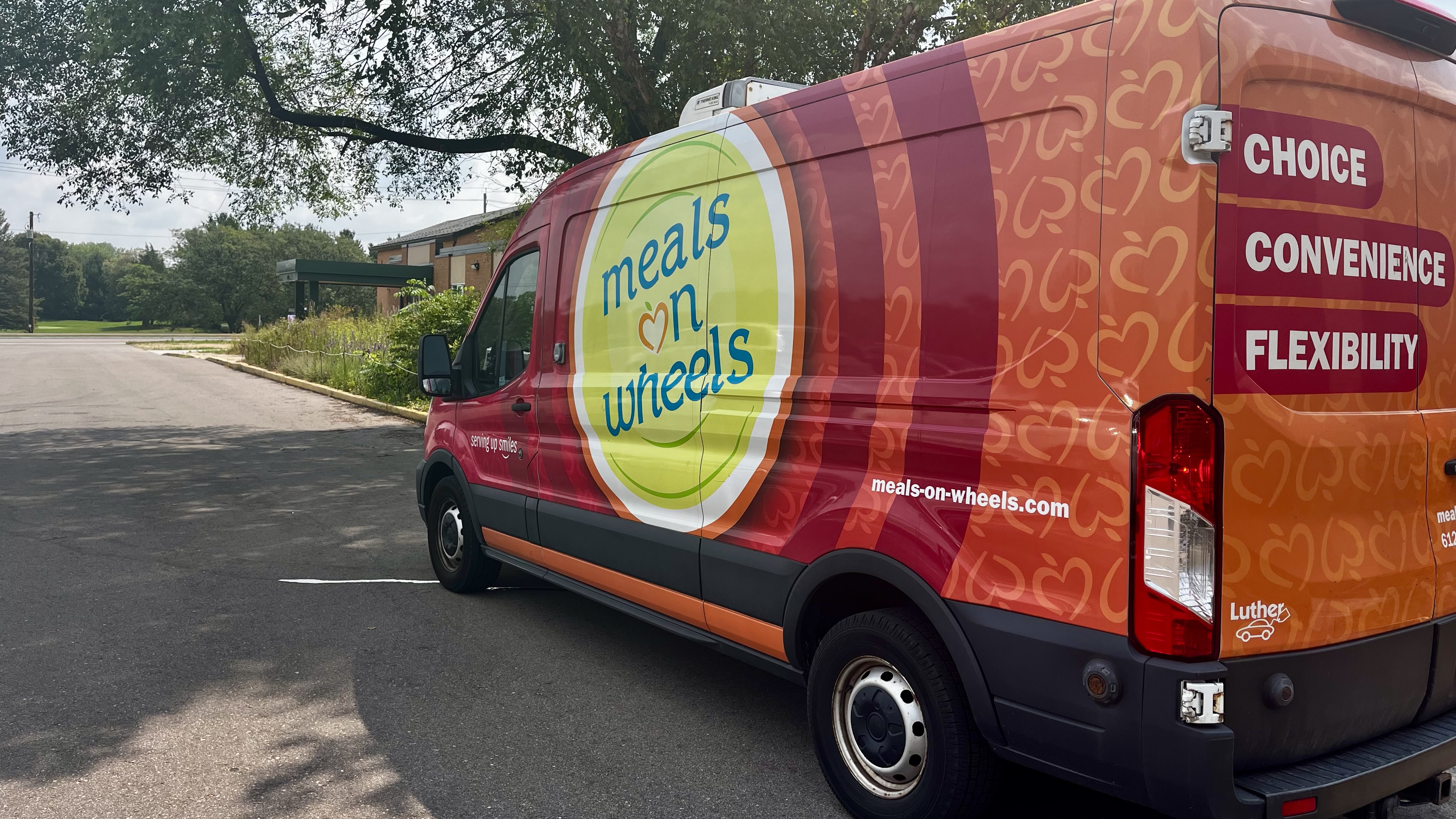 Meals on Wheels delivery van parked outside Merrick Community Services
