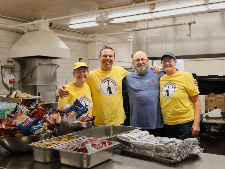 Volunteers preparing food at Merrick’s Backpack Distribution