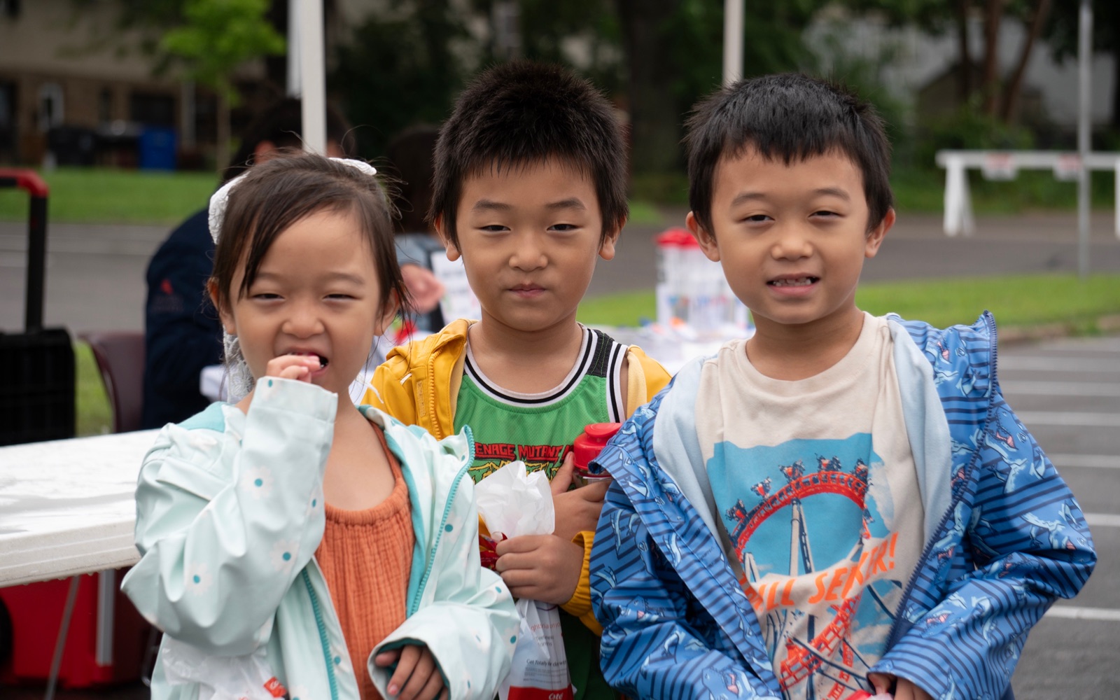 Three children at a community event